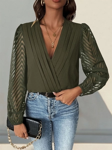 Detail of dark green V-neck bodysuit featuring pleated bodice and sheer lace long sleeves