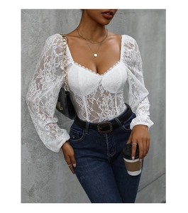 Detailed view of white floral lace bodysuit with sweetheart neckline and sheer sleeves