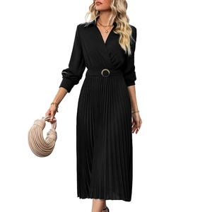 Detail of black pleated long-sleeve dress featuring a V-neckline and round buckle belt