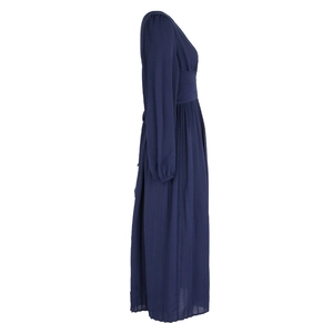Detail of navy blue long sleeve maxi dress showing high waist pleats and elastic cuffs