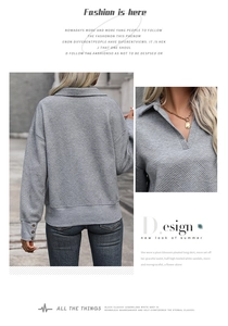 Macro detail of grey chevron texture and collar on a long sleeve polo sweatshirt