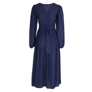 Detail of navy blue pleated midi dress featuring a deep V-back and waist tie-up bow