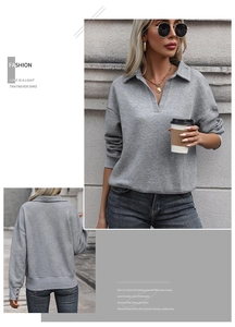 Detail of grey polo sweatshirt with geometric textured fabric and v-neck collar design