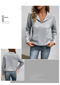 Details des grauen gesteppten Sweatshirts mit silbernem Druckknopfkragen und Taschen