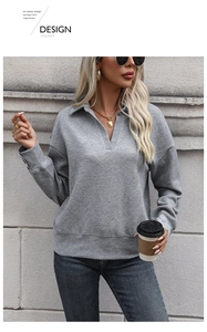 Detail of grey textured long sleeve polo sweatshirt with geometric diamond pattern