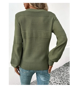 Detail view of olive green knit sweater featuring unique wavy textures on back and sleeves