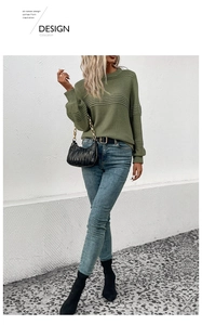 Detailed close-up of olive green knit sweater featuring textured horizontal pleat accents