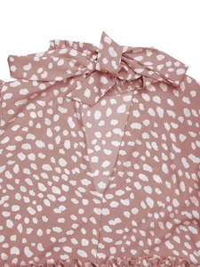 Close-up of leopard print neckline with tie-up bow and V-neck hollow design