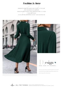 Detail of dark green pleated dress featuring premium long sleeves and matching waist belt