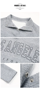 Detail of grey quilted pullover featuring a snap-button collar and Los Angeles print