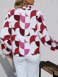 Back view of a long-sleeved women's blouse with wine red geometric half-circle patterns