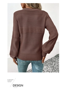 Detail of dark brown long sleeve knit sweater showing rib textured back and cuffs