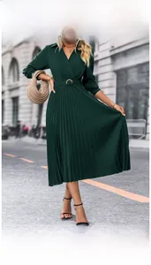 Detail of dark green pleated long sleeve dress with V-neck wrap design and waist belt