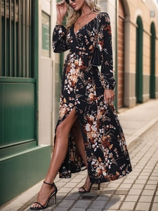 Detail of V-neck long sleeve dress featuring retro floral print and high side slit