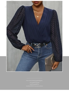 Detail of V-neck bodysuit with pleated cross design and sheer polka dot sleeves