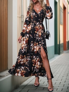 Detailed view of floral long dress featuring V-neck and high side slit in street setting