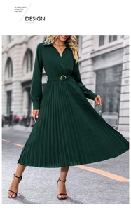 Detailed view of the dark green pleated midi dress featuring a lapel V-neck and belt buckle