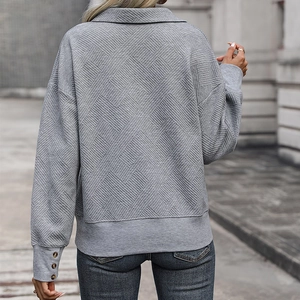 Grey textured sweatshirt for women with lapel collar and button cuffs from a back view