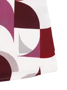 Detail of geometric pattern on women blouse fabric with professional stitching at bottom