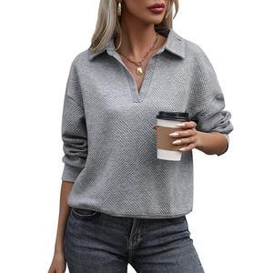 Women's grey textured polo sweatshirt with long sleeves and elegant v-neck collar