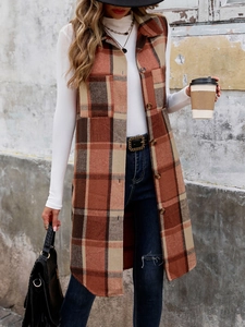 Detail of vintage plaid long vest with buttons and classic notched lapel design