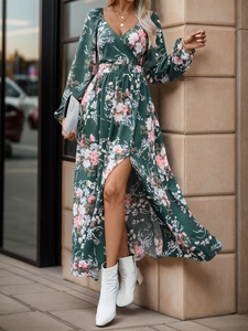 Detail of floral chiffon dress with V-neck wrap waist and high slit in dark green