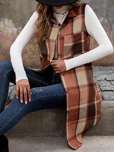 Detail of checkered plaid vest featuring breast pockets and brown button closure