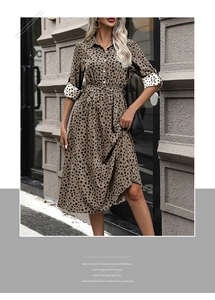 Detailed view of long sleeve leopard print shirt dress with cuffed sleeves and waist belt