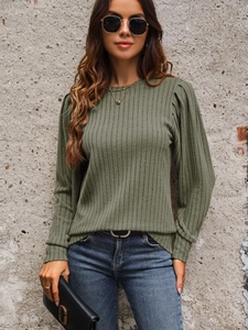 Detail of olive green ribbed long sleeve top with stylish puff sleeves and round neck