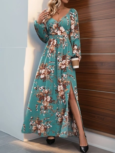Detail view of long sleeve floral dress with V-neck, waist cinching and a high side slit