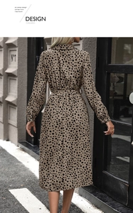 Detail of leopard print long sleeve shirt dress with adjustable waist belt and lapel collar