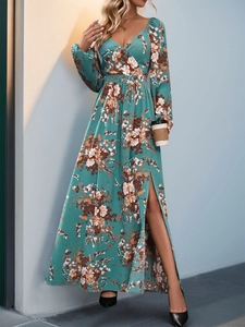Detail showing the elegant V-neckline and retro floral print of this long sleeve dress