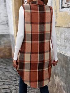 Detail view of the vintage plaid vest showing the long back hem and woven texture