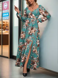 Detailed view of elegant teal floral long dress with high side slit and lantern sleeves
