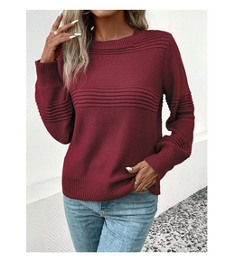Detail view of wine red knit sweater showing ribbed texture and round neckline