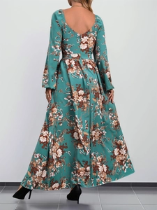 Long sleeve vintage floral print dress in dark green with high waist and flowy maxi hemline