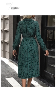 Detail of dark green leopard print shirt dress with lapel collar and waist tie belt