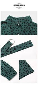 Detail of dark green polka dot shirt dress featuring lapel collar and adjustable belt