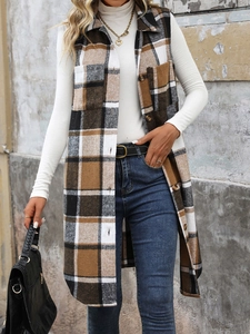 Detail of vintage plaid sleeveless long vest with notched collar and button accents