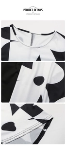 Close-up of crew neck and black and white geometric print on elastic fabric dress