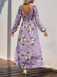 Detailed back view of a long-sleeved floral maxi dress with elegant V-neck and waist tailoring