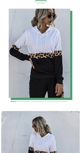 Detail view of hooded tracksuit with leopard print contrast panels and side stripes