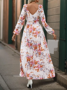 Detail of elegant backless V-neck floral long sleeve white dress with pink flower patterns