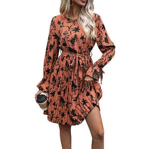 Long sleeve pleated dress in burnt orange with floral print and waist tie-up