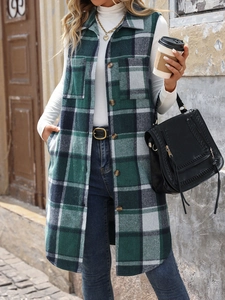 Detail of plaid sleeveless cardigan with side pockets and classic button closure