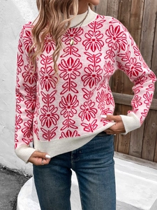 Detail of mock neck knit sweater featuring large pink floral patterns and ribbed cuffs