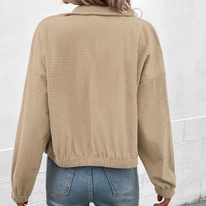 Back view of women's khaki corduroy stand collar jacket with dropped shoulder design
