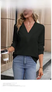 Detail of elegant black V-neck long sleeve top for women with stylish pleated fabric texture