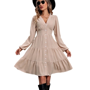 Elegant apricot long sleeve V-neck tiered dress with belted waist and lantern sleeves