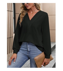Detail of elegant black V-neck long-sleeve blouse with stylish crossover design